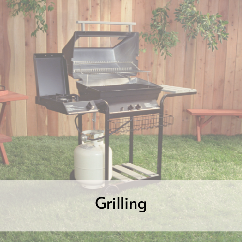 Propane gas grill with side burner on the lefthand side. 