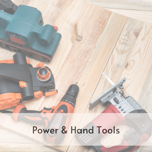 Various power tools on a wooden table.