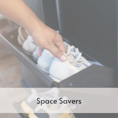 Person placing shoes in a fold down cabinet front.