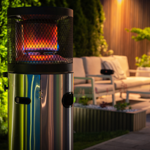 Modern propane patio heater with mesh covering.